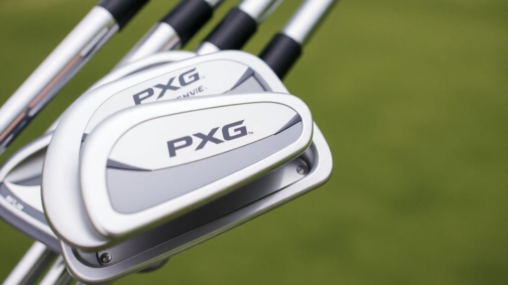 PXG golf irons on a green course.